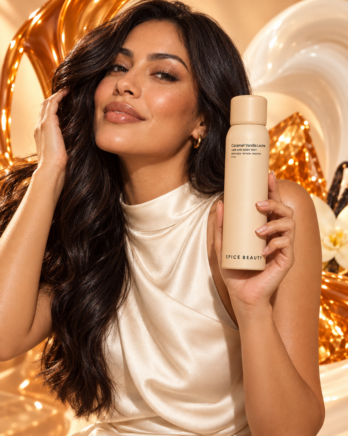 Woman with glossy dark hair holding Caramel Vanilla Leche Hair & Body Mist in golden caramel light